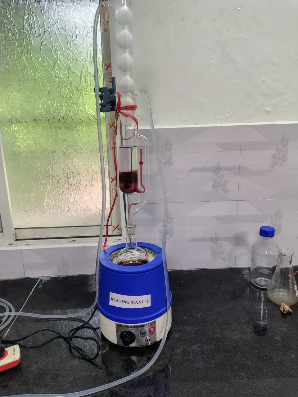 Heating mantle and condenser glassware setup used for R&D analysis