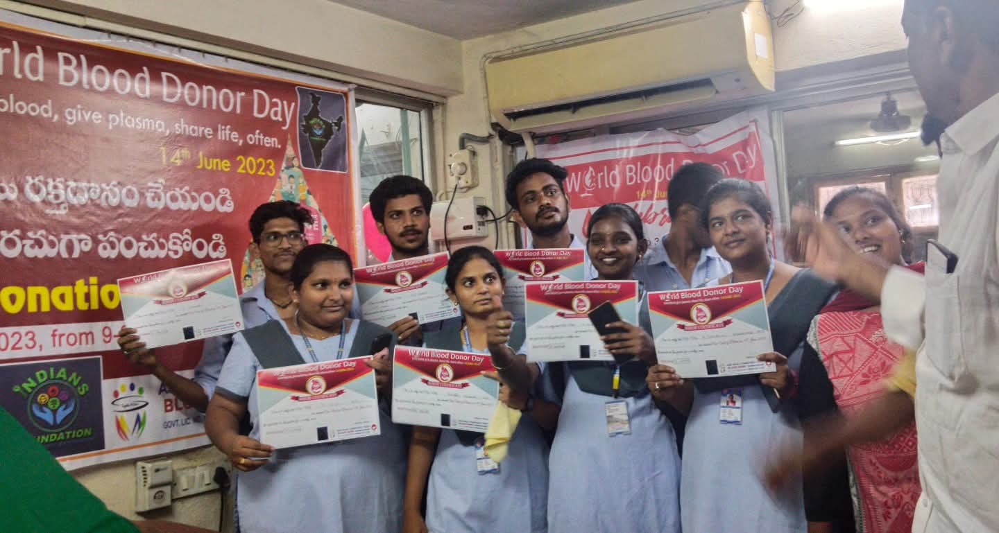 Blood donation camp — donors holding donor certificates