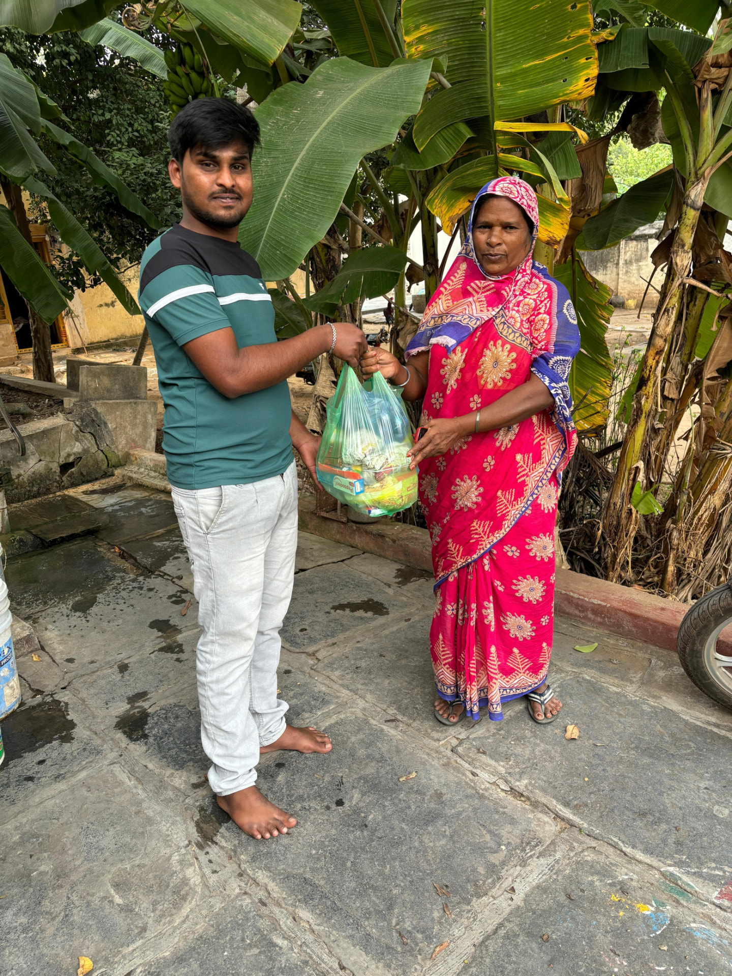 Grocery kit being handed over during food distribution